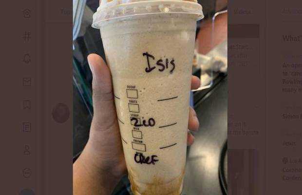 writing ISIS on Aishah's coffee cup