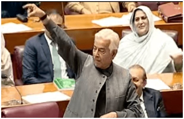 Khawaja Asif waves a wristwatch during NA session in response to commotion by PTI-backed MNAs
